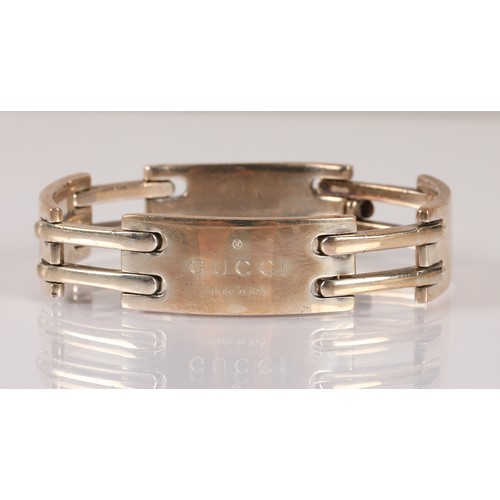 123 - Silver bracelet inscribed 'Gucci', hallmarked GI (Gucci Timepieces) London, 60g