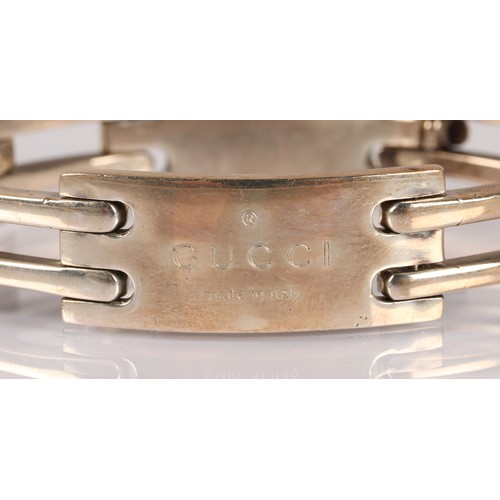 123 - Silver bracelet inscribed 'Gucci', hallmarked GI (Gucci Timepieces) London, 60g