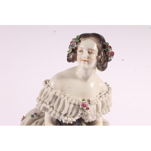 413 - German Volkstedt Dresden Lace porcelain figurine, early 20th century, of a debutante in frilled lace... 