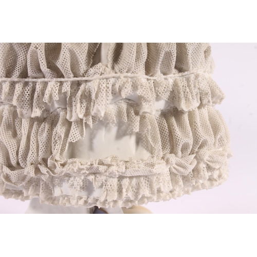 413 - German Volkstedt Dresden Lace porcelain figurine, early 20th century, of a debutante in frilled lace... 