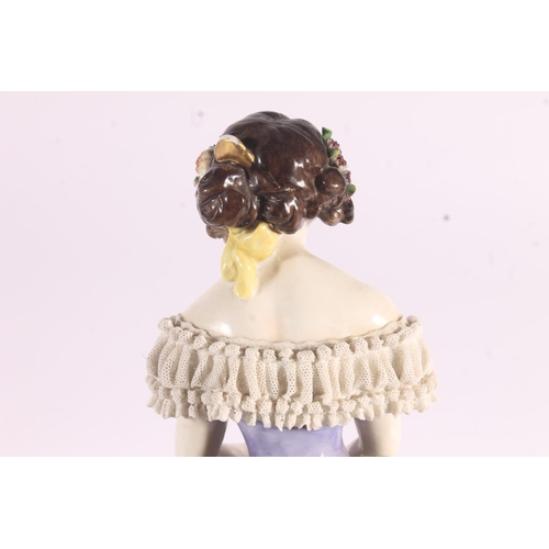 413 - German Volkstedt Dresden Lace porcelain figurine, early 20th century, of a debutante in frilled lace... 