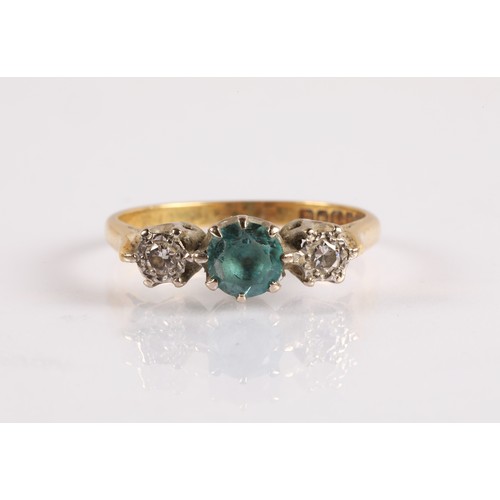 121 - 18ct gold ring set with a blue gemstone flanked by two diamonds in illusion settings, ring size O, 3... 