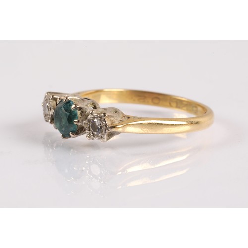 121 - 18ct gold ring set with a blue gemstone flanked by two diamonds in illusion settings, ring size O, 3... 