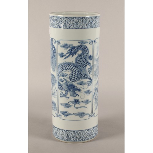 43 - Oriental blue and white cylindrical vase decorated with panels of animals, signed to base. 37cm