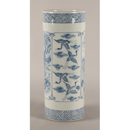 43 - Oriental blue and white cylindrical vase decorated with panels of animals, signed to base. 37cm