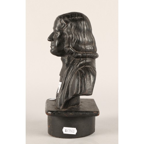 44 - 19th century cast metal door stop in the form of the Methodist founder John Wesley.