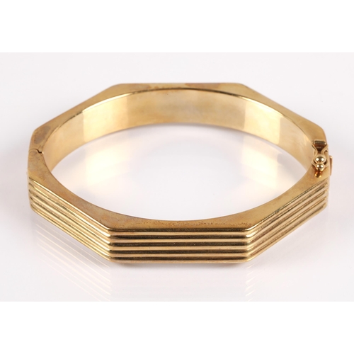 50 - 9ct gold octagonal stiff bangle, marked 9Kt on clasp, 21.5g