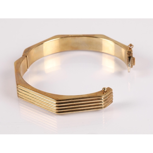 50 - 9ct gold octagonal stiff bangle, marked 9Kt on clasp, 21.5g