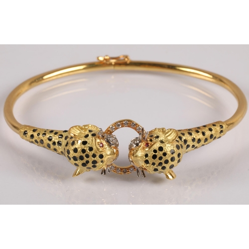 51 - 18k gold bangle in the form of two leopards grasping a ring, set with diamonds, rubies for eyes and ... 