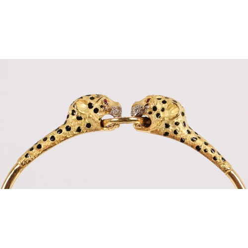 51 - 18k gold bangle in the form of two leopards grasping a ring, set with diamonds, rubies for eyes and ... 