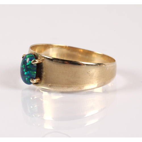 56 - 14kt gold ring set with a simulated dark blue opal, ring size Q, 2.3g