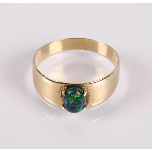 56 - 14kt gold ring set with a simulated dark blue opal, ring size Q, 2.3g