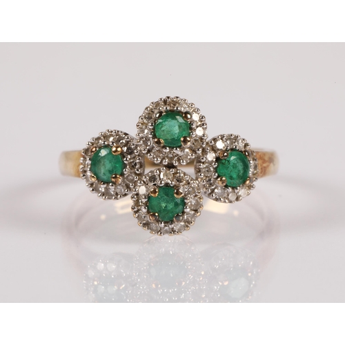 63 - 9ct gold ring set with emeralds surrounded by diamonds in four clusters, ring size K/L, 2g