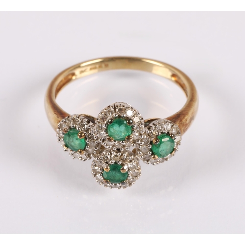 63 - 9ct gold ring set with emeralds surrounded by diamonds in four clusters, ring size K/L, 2g