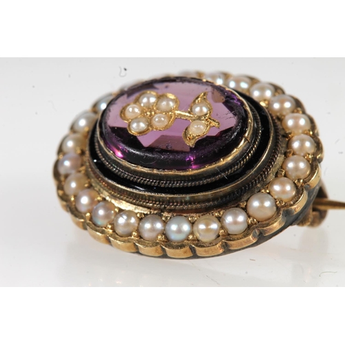 671 - Antique gold amethyst and seed pearl set brooch, the central stone set with floral pearl.