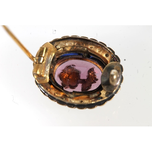 671 - Antique gold amethyst and seed pearl set brooch, the central stone set with floral pearl.