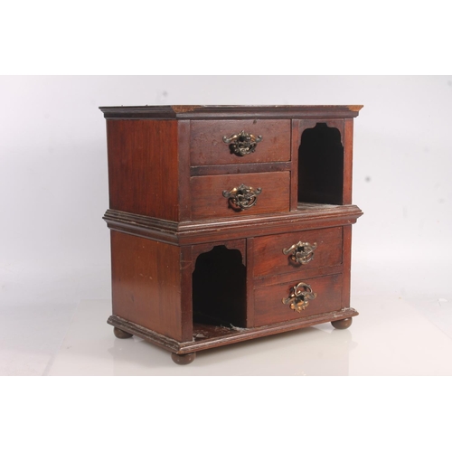 11 - Late 19th century four drawer cabinet with arched top compartments, 36cm high.