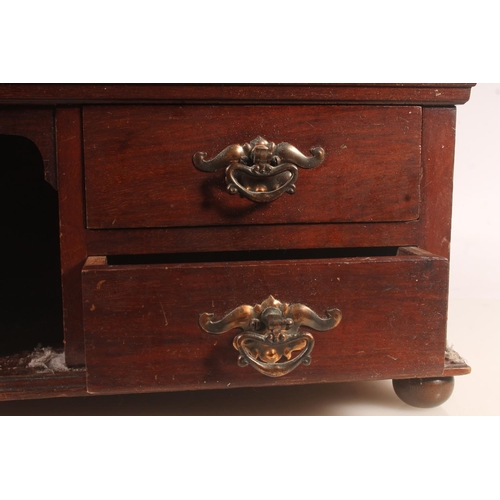 11 - Late 19th century four drawer cabinet with arched top compartments, 36cm high.