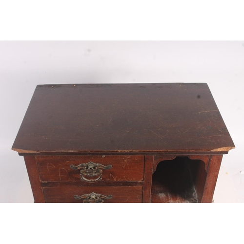 11 - Late 19th century four drawer cabinet with arched top compartments, 36cm high.