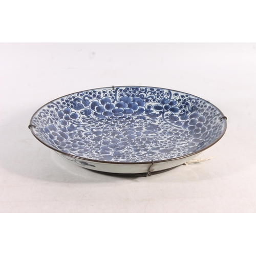 24 - Chinese porcelain charger decorated in blue foliate pattern, 35cm.