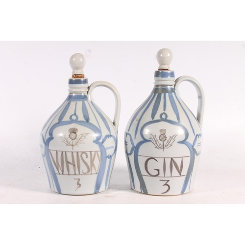 27 - Pair of Buchan stoneware whisky and gin decanters and a Buchan Festival platter.