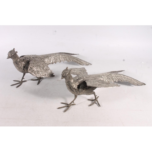 28 - Pair of polished pewter pheasant models, 38cm long.