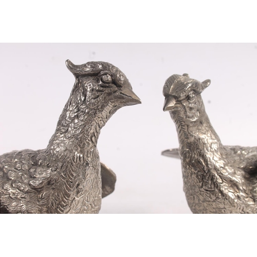 28 - Pair of polished pewter pheasant models, 38cm long.