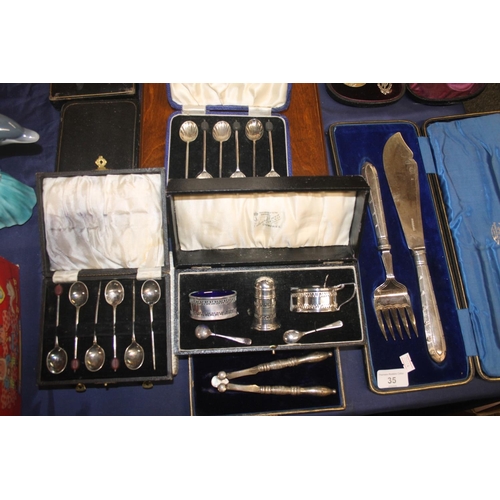 35 - Silver-plated cutlery to include a pair of late Victorian cast metal berry spoons with ornate pheasa... 