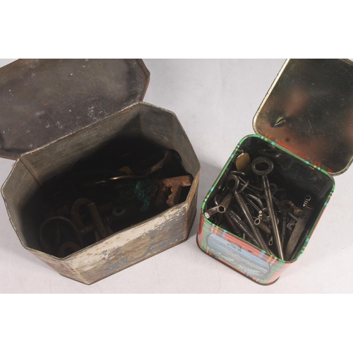 54 - Two tins containing keys, and a box inset with commemorative coins.