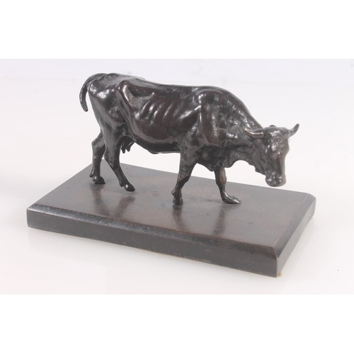 9 - Cast bronze model of a cow, 14cm wide.