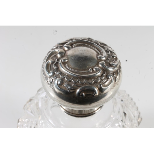 517 - Early 20th century silver topped cut glass perfume bottle, the collar with hallmarks for Chester 191... 