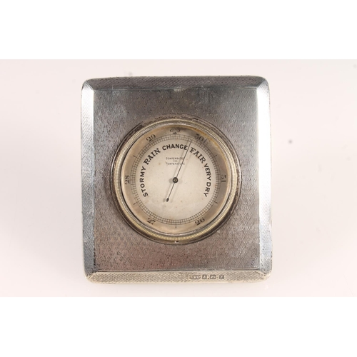 518 - Art Deco silver easel backed table barometer with engine turned decoration by Arthur Barnett & C... 