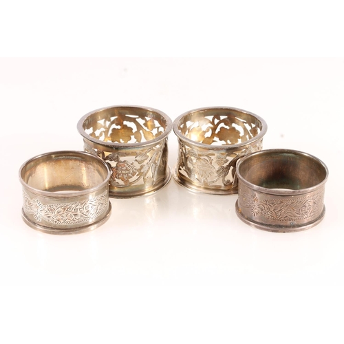 519 - A pair of silver napkin rings by K Bros, Birmingham 1909 and another pair of silver napkin rings, 71... 