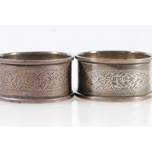 519 - A pair of silver napkin rings by K Bros, Birmingham 1909 and another pair of silver napkin rings, 71... 