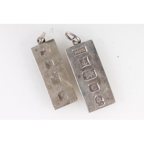 523 - Two silver ingot pendants 60g gross.