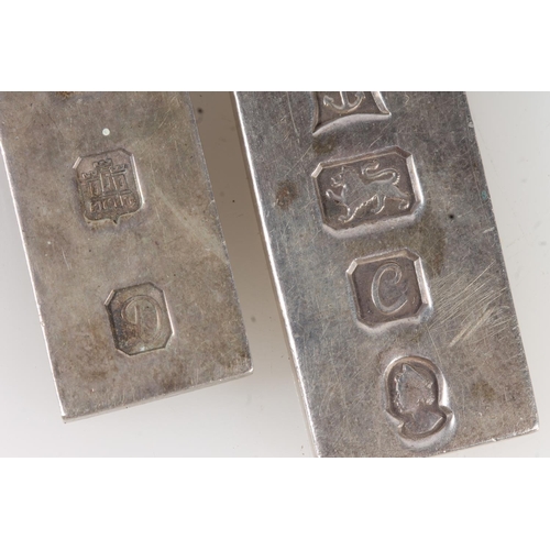 523 - Two silver ingot pendants 60g gross.