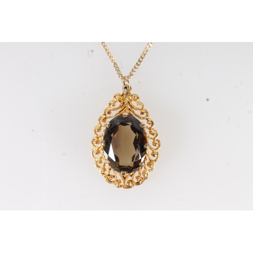 653 - 9ct gold mounted smoky quartz pendant on 9ct gold chain, 5.1g gross.