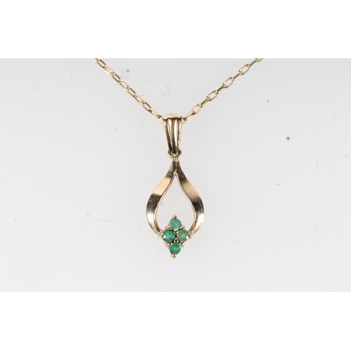 654 - 9ct gold mounted four stone emerald pendant on 9ct gold chain, 2.1g gross.