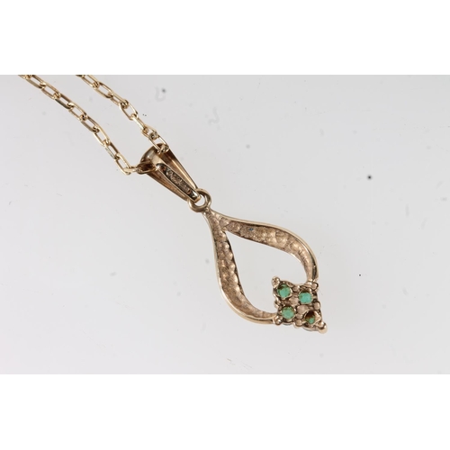 654 - 9ct gold mounted four stone emerald pendant on 9ct gold chain, 2.1g gross.