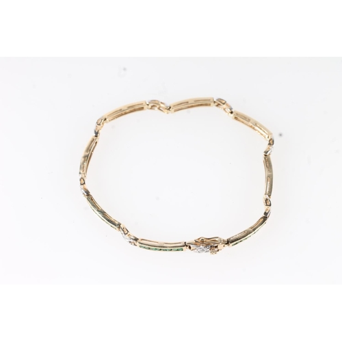 657 - 9ct gold tennis style bracelet set with small diamonds and emeralds, 6.7g gross.