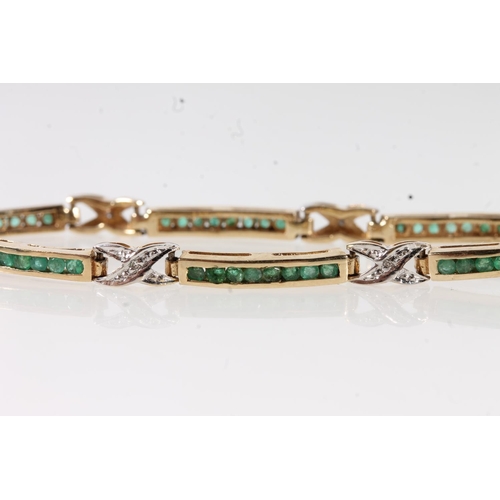 657 - 9ct gold tennis style bracelet set with small diamonds and emeralds, 6.7g gross.