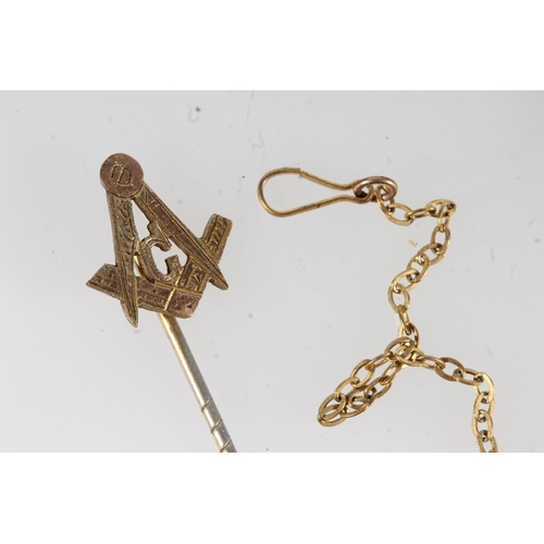 658 - Yellow metal tie pin with Masonic G and compass top, also four yellow metal or gilded safety chains.