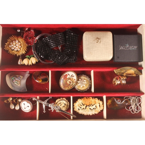 661 - Jewellery box containing costume jewellery to include a large amber pendant with silver mounts on si... 