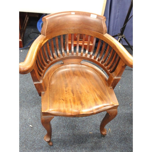 767 - Mahogany captains style armchair with castors.