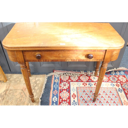 772 - Victorian mahogany Demi lune fold over tea table, with single frieze drawer on shaped legs. 