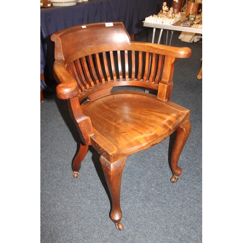 767 - Mahogany captains style armchair with castors.