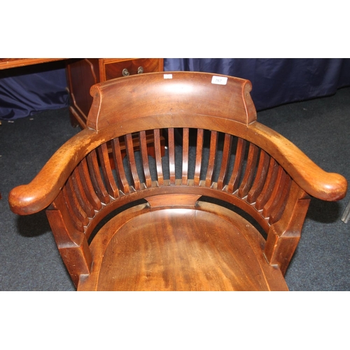 767 - Mahogany captains style armchair with castors.