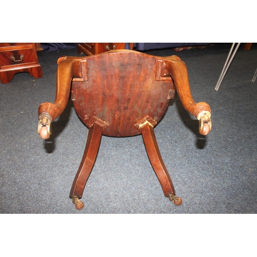 767 - Mahogany captains style armchair with castors.