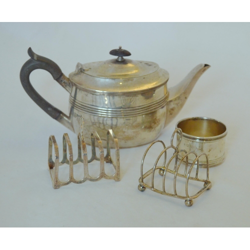 68 - Edward VII silver bachelor's teapot, Sheffield 1907-8, a silver toast rack by Garrard & Co., Lon... 