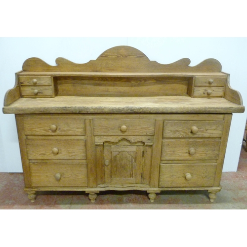 529 - Victorian scumbled pine dresser, the shaped gallery with short drawers above further short drawers a... 